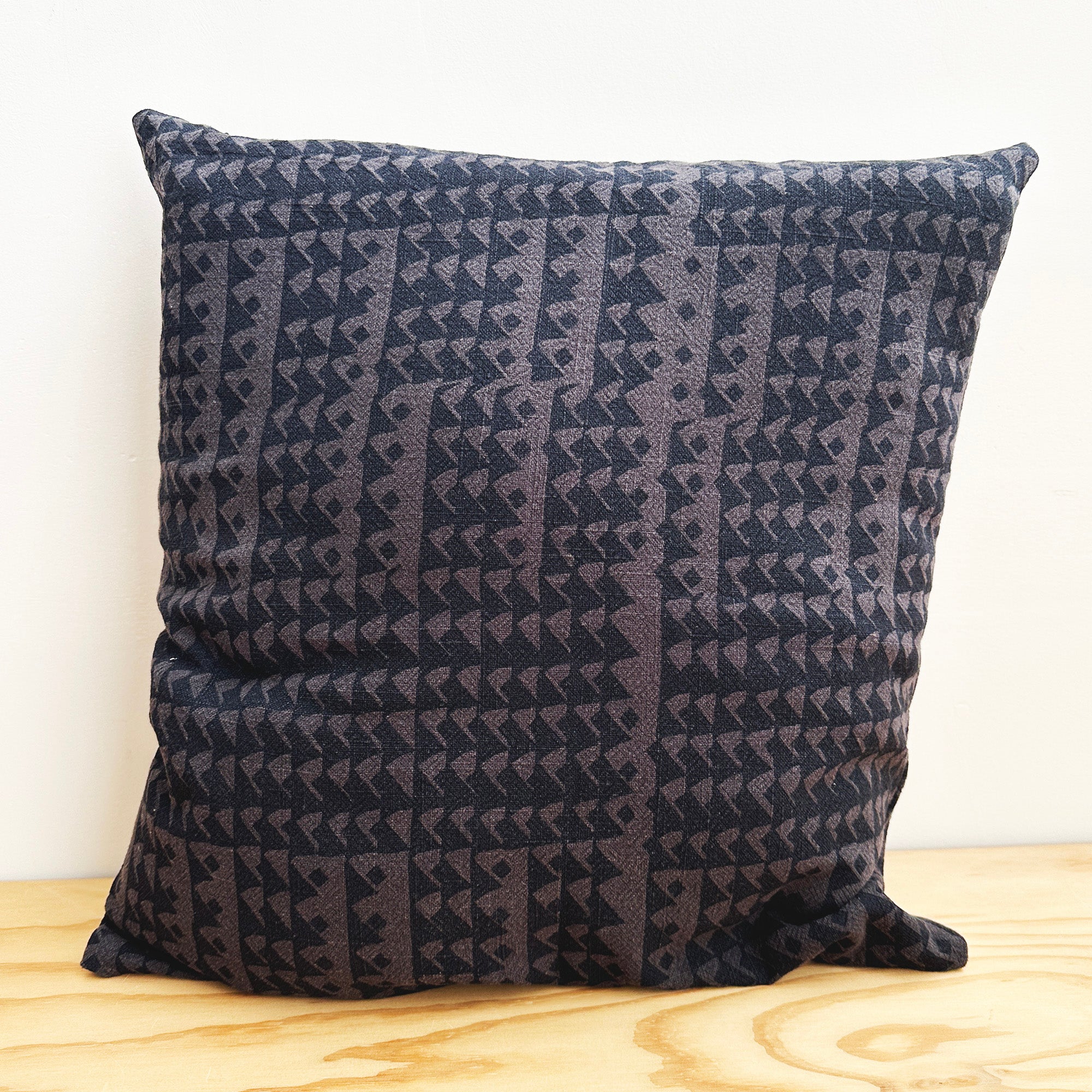 The Square Throw Pillow - Triangles in Midnight and Faded Black
