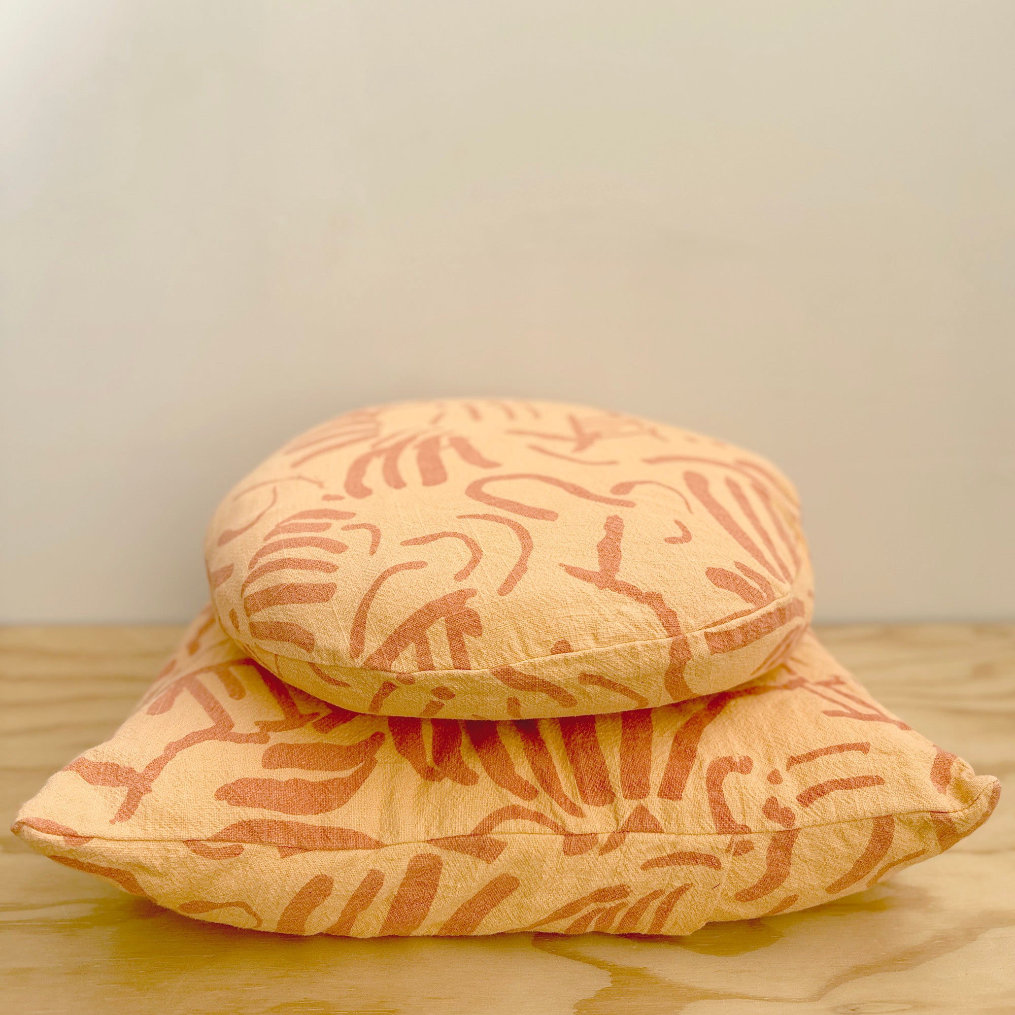 The Square Throw Pillow - Fold in Melon and Tangerine