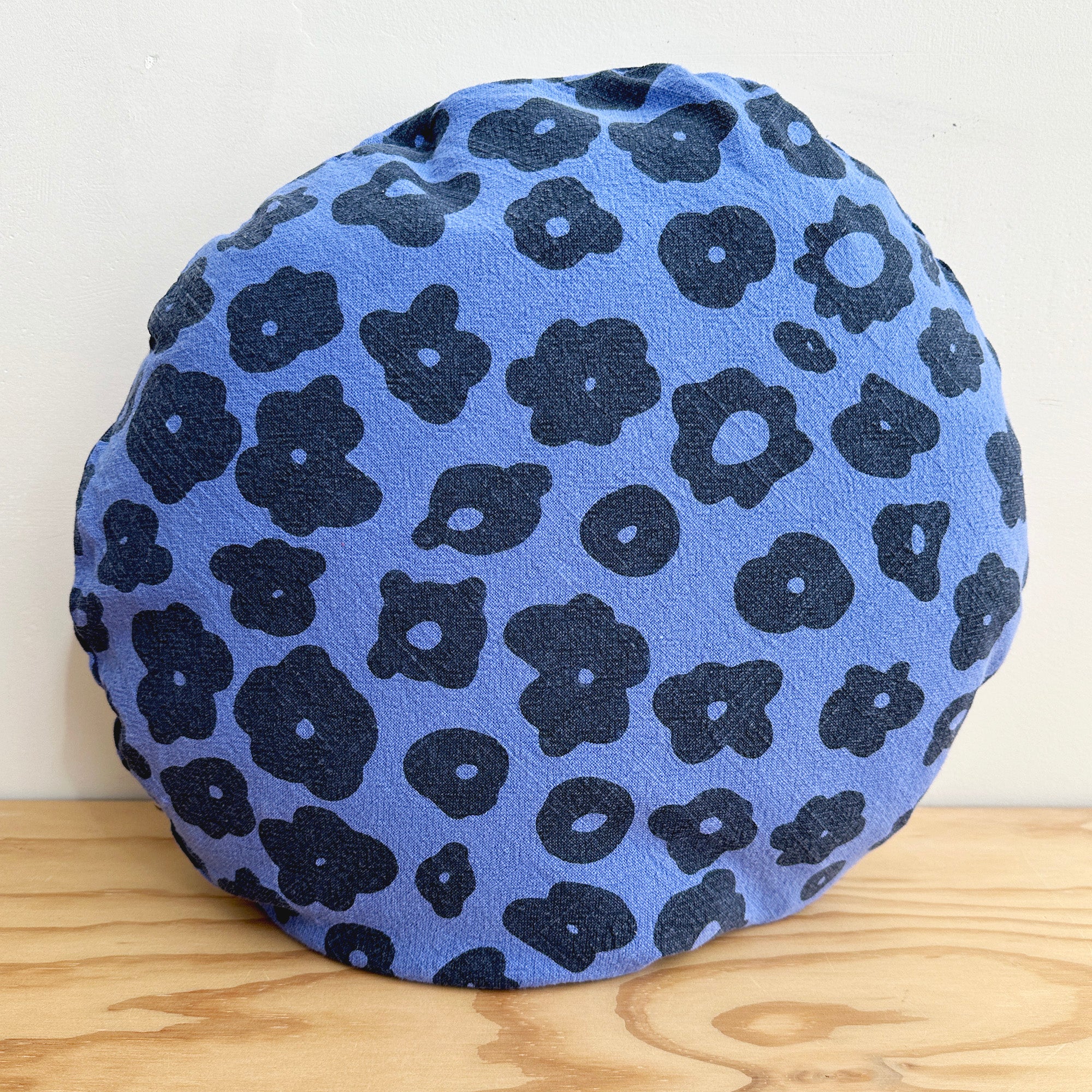 The Round Throw Pillow - Celeste in Faded Black and Periwinkle