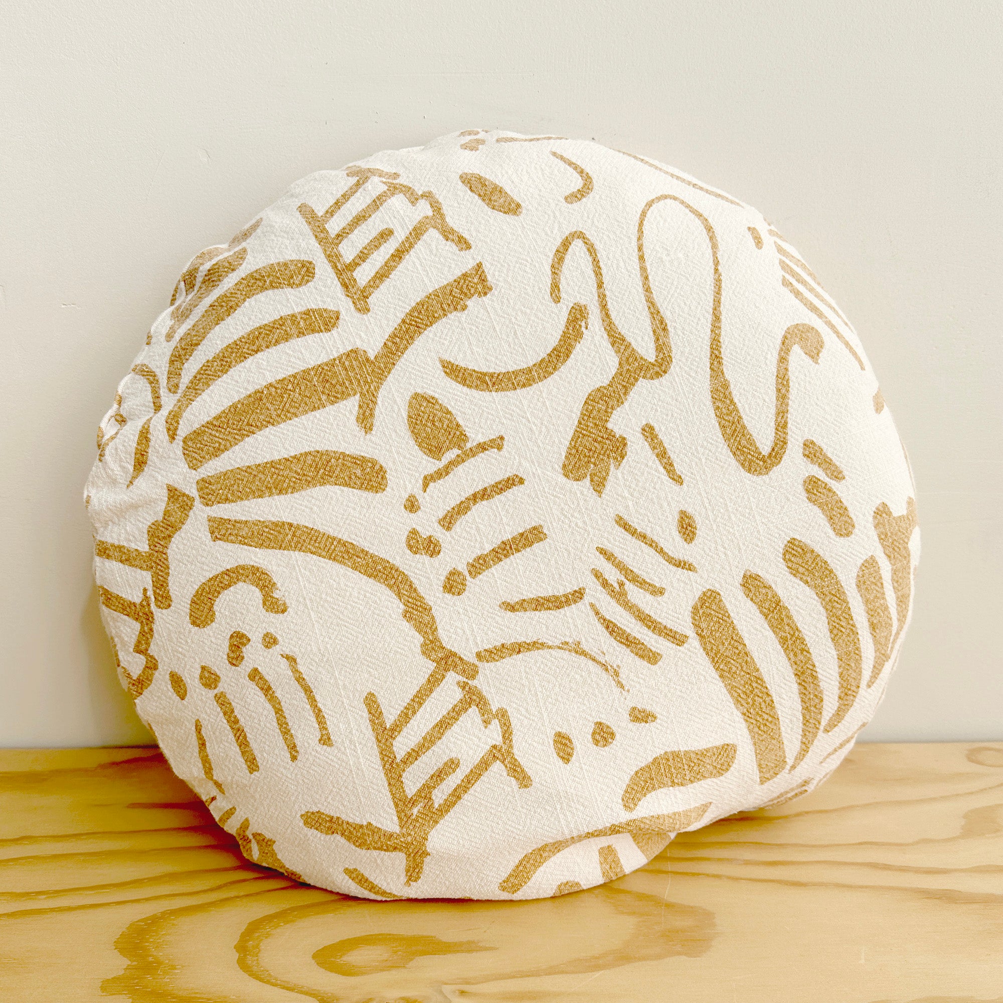 The Round Throw Pillow - Fold in Gold