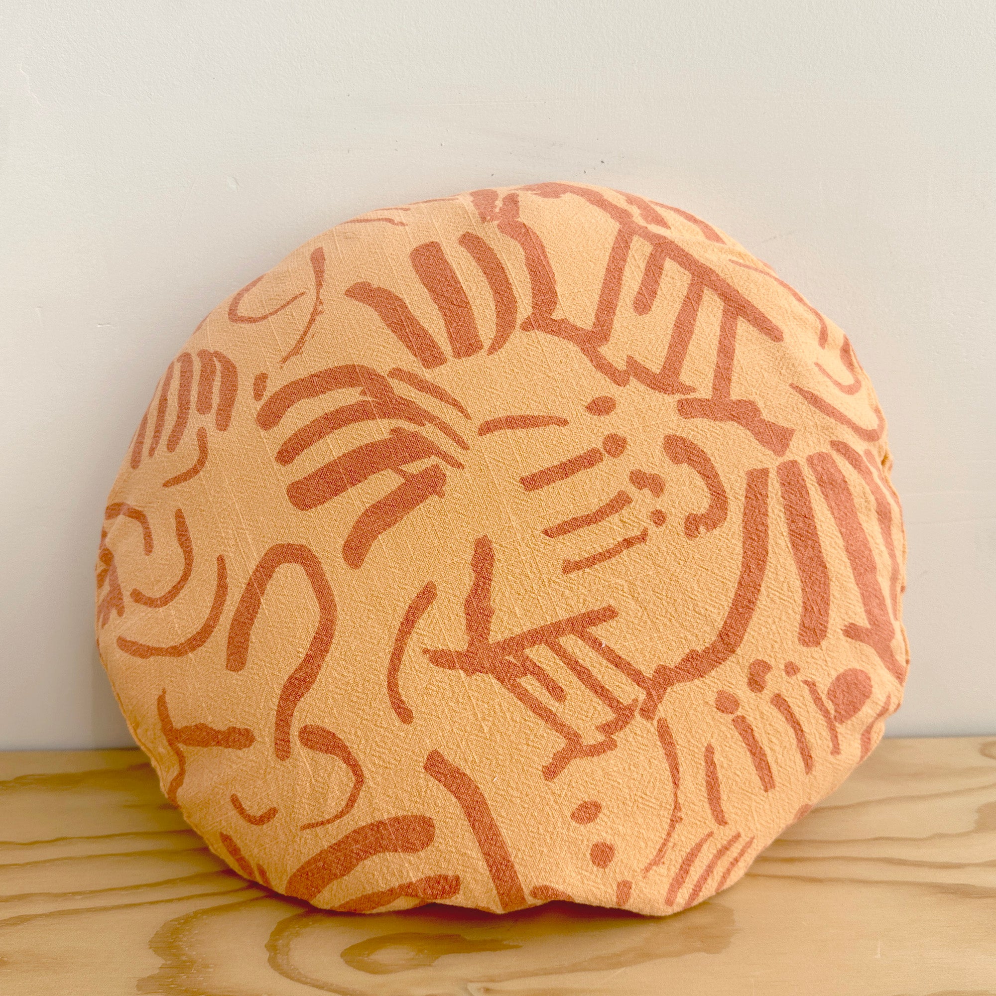 The Round Throw Pillow - Fold in Melon and Tangerine